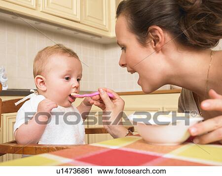 mother feeding baby View Large Photo Image Stock Image - mother feeding baby. Fotosearch