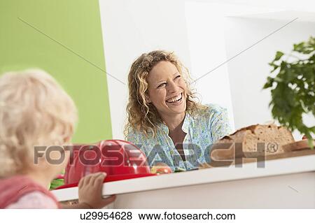 mother laughing with family View Large Photo Image Stock Photo - mother laughing with family. Fotosearch
