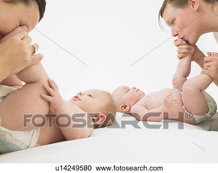 mothers playing with babies View Large Photo Image Stock Image - mothers playing with babies. Fotosearch