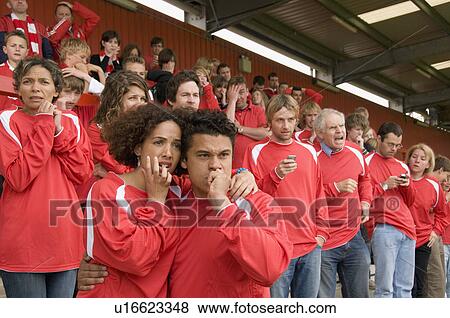 Stock Photo - Nervous fans at football match. Fotosearch