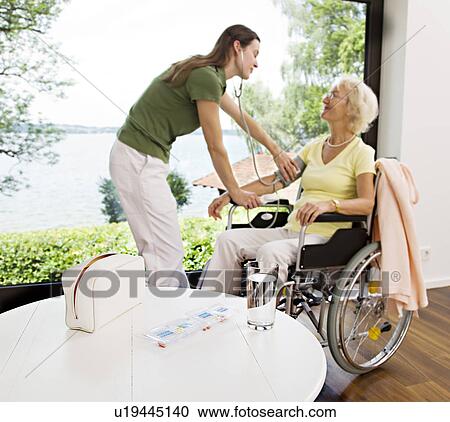 nurse taking woman's blood pressure View Large Photo Image Stock Image - nurse taking woman's blood pressure. Fotosearch