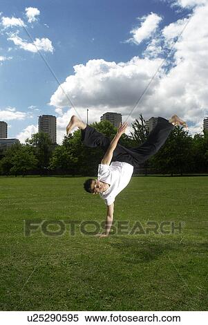 one hand handstand View Large Photo Image Stock Photography - one hand handstand. Fotosearch