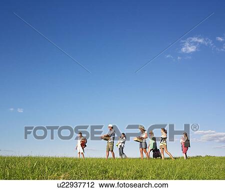 Stock Image - people going for a picnic. Fotosearch