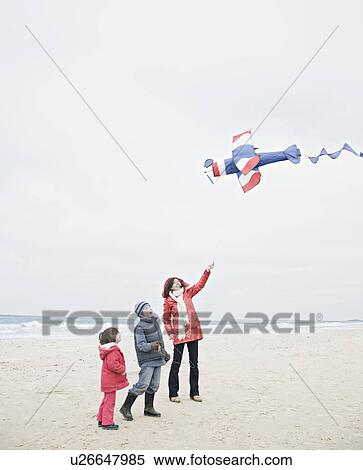 People on beach with kite View Large Photo Image Stock Photography - People on beach with kite. Fotosearch