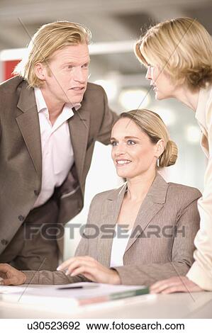 Stock Image - people working in an office. Fotosearch