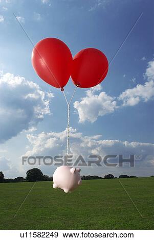 Stock Photo - piggy bank tied to balloons. Fotosearch