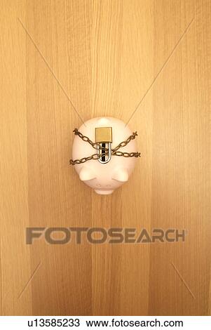 piggy bank wrapped in chains and lock View Large Photo Image Stock Image - piggy bank wrapped in chains and lock. Fotosearch