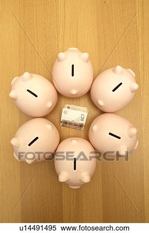 Stock Photography - piggy banks guarding money. Fotosearch