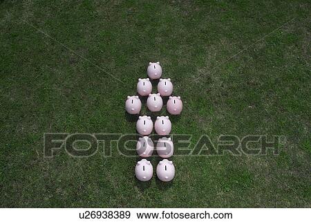 piggy banks in an arrow formation View Large Photo Image Stock Photo - piggy banks in an arrow formation. Fotosearch