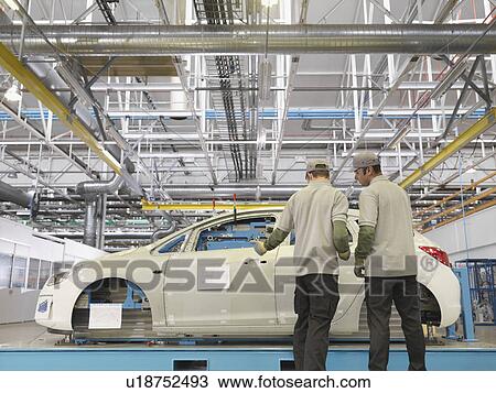 Plant Workers Inspecting Shell Of Car View Large Photo Image Stock Image - Plant Workers Inspecting Shell Of Car. Fotosearch