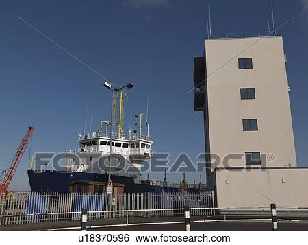 Stock Photograph - Port Control Tower & Ship. Fotosearch