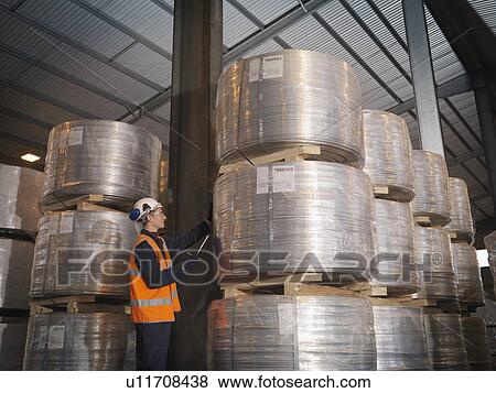 Stock Photo - Port Worker Checking Cargo. Fotosearch