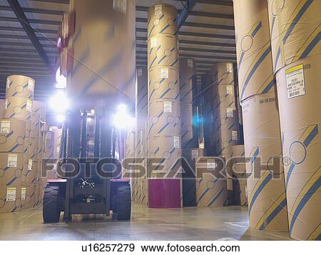 Stock Photo - Port Worker In Fork Lift In Warehouse. Fotosearch