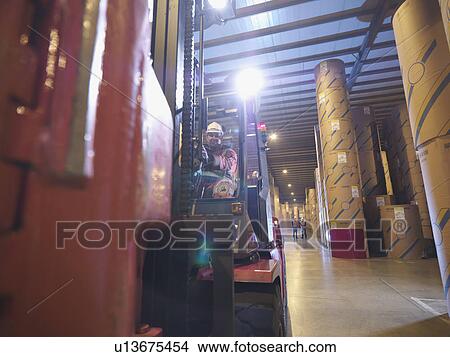 Picture - Port Worker In Fork Lift Truck. Fotosearch