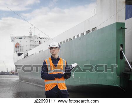 Port Worker In Front Of Container Ship View Large Photo Image Stock Photo - Port Worker In Front Of Container Ship. Fotosearch