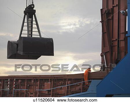 Picture - Port Worker Inspecting Cargo. Fotosearch