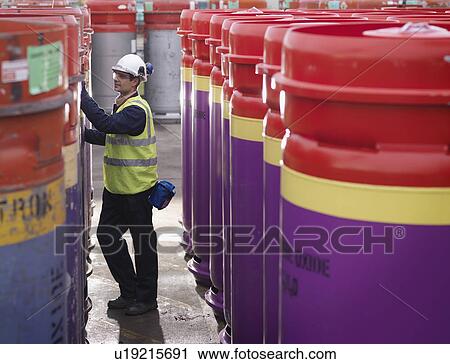 Port Worker Inspecting Containers View Large Photo Image Stock Image - Port Worker Inspecting Containers. Fotosearch