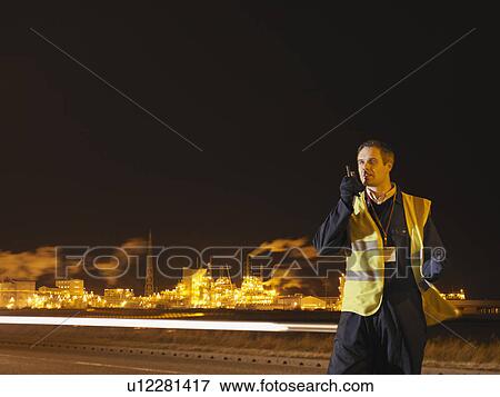 Stock Photo - Port Worker Outside At Night. Fotosearch