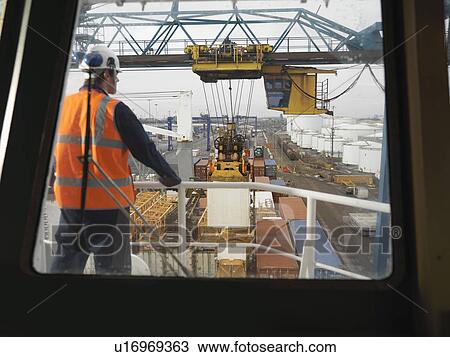 Port Worker Overseeing Loading Of Ship View Large Photo Image Stock Image - Port Worker Overseeing Loading Of Ship. Fotosearch