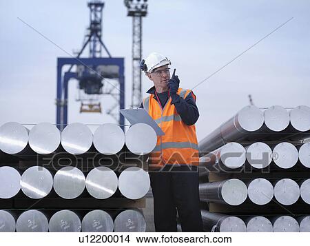 Picture - Port Worker With Cargo & Clipboard. Fotosearch