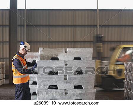Port Worker With Heavy Cargo View Large Photo Image Stock Image - Port Worker With Heavy Cargo. Fotosearch