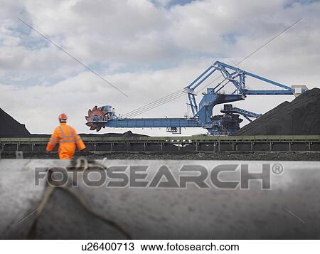 Port Worker With Heavy Machinery View Large Photo Image Stock Image - Port Worker With Heavy Machinery. Fotosearch