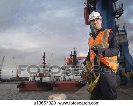 Stock Photo - Port Worker With Ships. Fotosearch