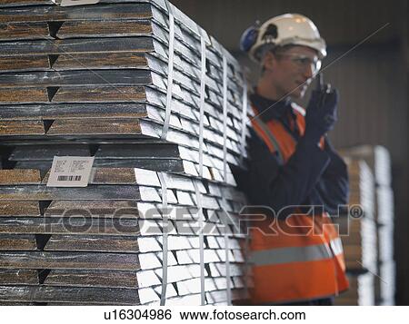 Stock Photograph - Port Worker With Walkie Talkie & Cargo. Fotosearch