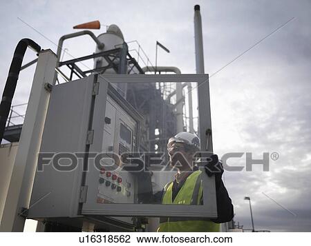 Port Worker Working With Control Panel View Large Photo Image Stock Image - Port Worker Working With Control Panel. Fotosearch