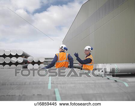 Port Workers Discussing Cargo View Large Photo Image Stock Photography - Port Workers Discussing Cargo. Fotosearch