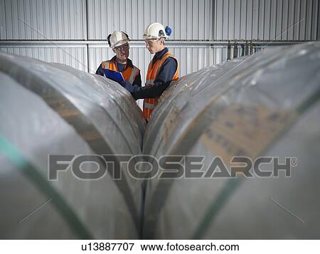 Stock Photo - Port Workers Inspecting Cargo. Fotosearch