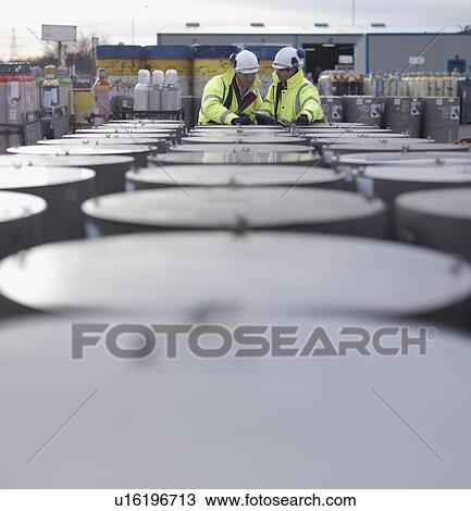Port Workers Inspecting Cylinders View Large Photo Image Stock Image - Port Workers Inspecting Cylinders. Fotosearch