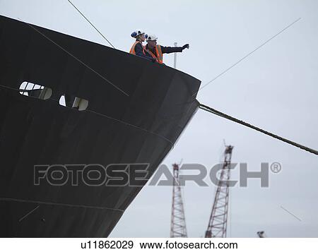 Port Workers On Bow Of Ship View Large Photo Image Stock Photo - Port Workers On Bow Of Ship. Fotosearch