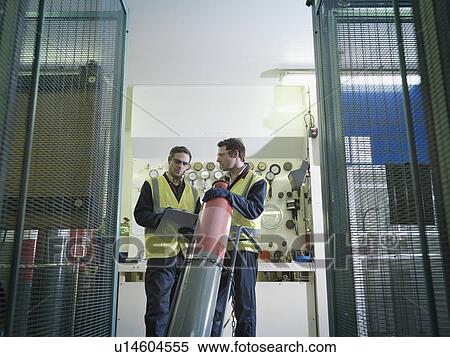Stock Photography - Port Workers With Gas Cylinder. Fotosearch