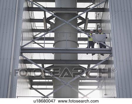 Stock Photo - Port Workers With Plans. Fotosearch