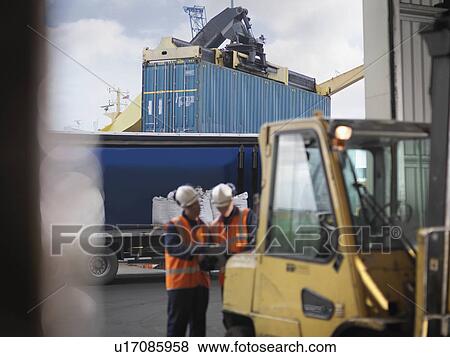 Port Workers With Shipping Container View Large Photo Image Stock Photo - Port Workers With Shipping Container. Fotosearch