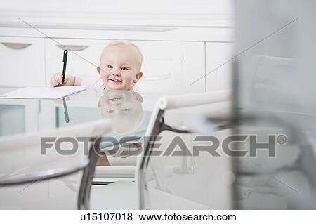 Portrait of a baby in an office chair View Large Photo Image Stock Photo - Portrait of a baby in an office chair. Fotosearch