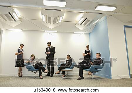 Portrait of a business group texting View Large Photo Image Stock Photo - Portrait of a business group texting. Fotosearch