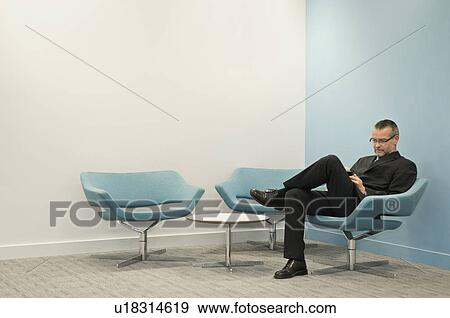 Portrait of a business man texting View Large Photo Image Stock Photo - Portrait of a business man texting. Fotosearch