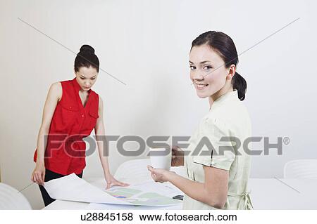 Stock Photo - Portrait of a business woman at work. Fotosearch