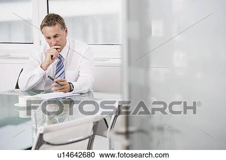 Portrait of a Businessman at work View Large Photo Image Stock Image - Portrait of a Businessman at work. Fotosearch