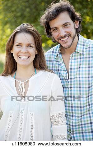 Stock Image - Portrait of a couple smiling in country. Fotosearch