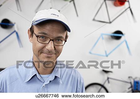 portrait of a man in a bikestore View Large Photo Image Stock Photograph - portrait of a man in a bikestore. Fotosearch