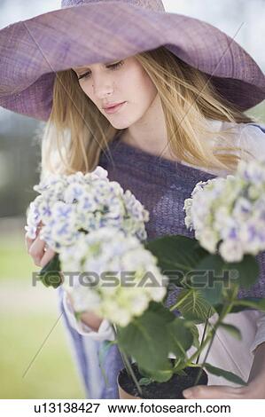 Stock Photo - Portrait of a woman with flowers. Fotosearch