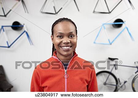 Portrait of a woman with glasses in bike shop View Large Photo Image Stock Photo - Portrait of a woman with glasses in bike shop. Fotosearch