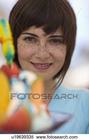Stock Photography - portrait of a woman with ice cream. Fotosearch