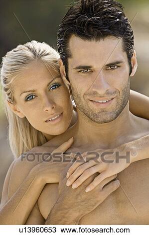 Stock Image - Portrait of a young beach couple. Fotosearch
