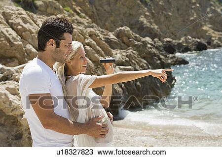 Stock Image - Portrait of a young beach couple. Fotosearch