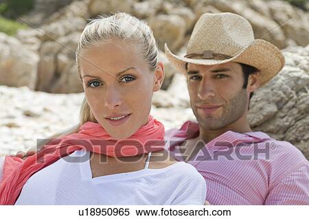 Stock Photography - Portrait of a young beach couple. Fotosearch