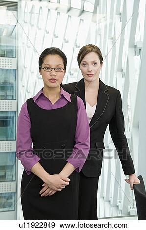 Stock Photo - Portrait of two business women.. Fotosearch